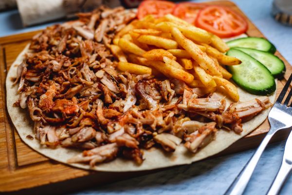sizzling doner kebabs served at city chippy takeaway in Manchester